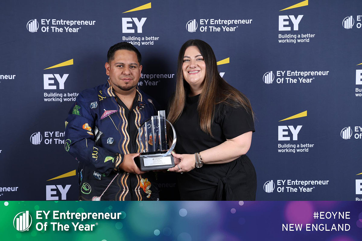Greta Bajrami and Freddie Campverde, co-founders of Golden Group Roofing hold the Entrepreneur of the Year 2023 award that Greta just won.