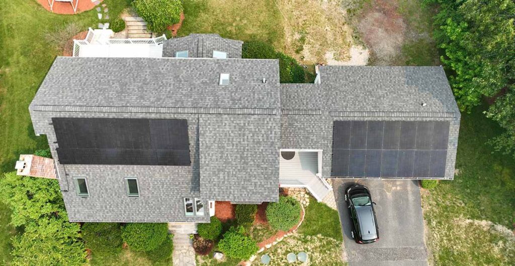 Aerial view of installing solar panels and roofing in Hopkinton, MA.