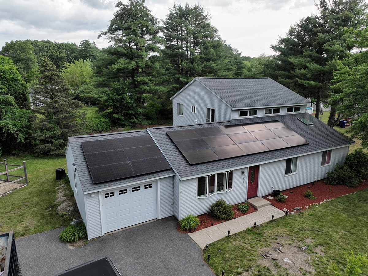 Aerial view of a house with solar panels on it done by Golden Group Solar in Massachusetts. This is for blog post concerning the cost of solar panels.