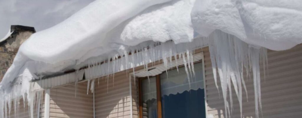 Snow and ice on a residential roof.
