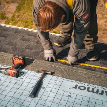 Golden-Group-Roofing-crew-measuring-Roof-and-Solar-installation-Framingham-MA